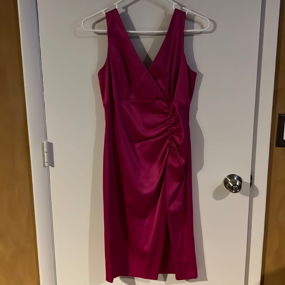 Pink silky dress below knee.